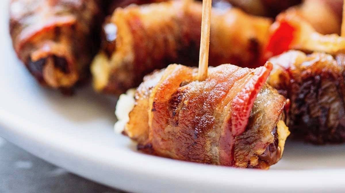 Goat Cheese Stuffed Bacon Wrapped Dates with Balsamic Reduction